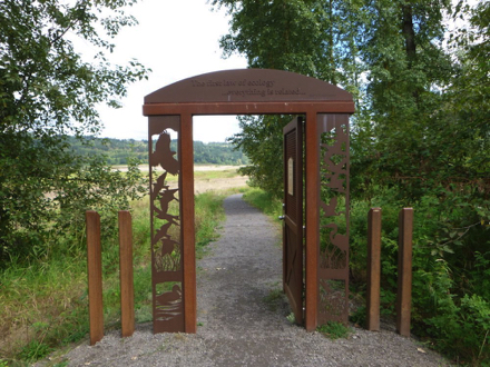 Decorative door to the wetland trail area that is closed in the off-season –  closed October through April